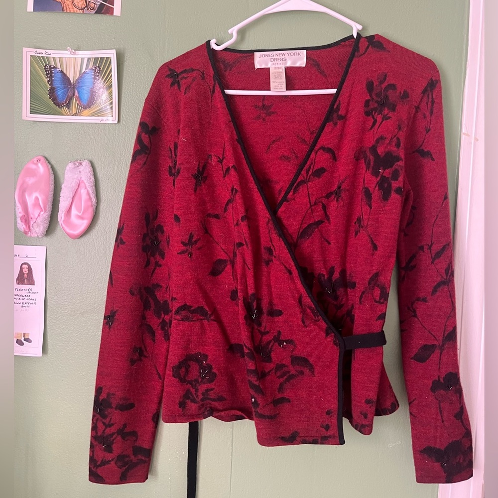 Red wrap sweater with black and beaded floral details